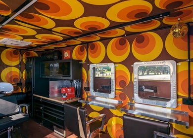 Retro-themed salon at Raw Heads, Eagle Vale, New South Wales, AU with vibrant decor and modern styling stations.