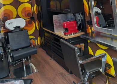 Retro-themed salon interior at Raw Heads, Eagle Vale, New South Wales, AU with bold patterns and modern equipment.