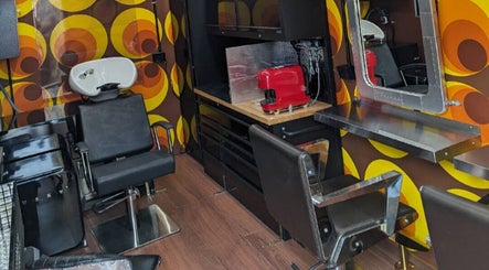 Retro-themed salon interior at Raw Heads, Eagle Vale, New South Wales, AU with bold patterns and modern equipment.