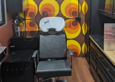 Chic salon chair and retro decor at Raw Heads, Eagle Vale, New South Wales, AU, offering top-notch wellness services.
