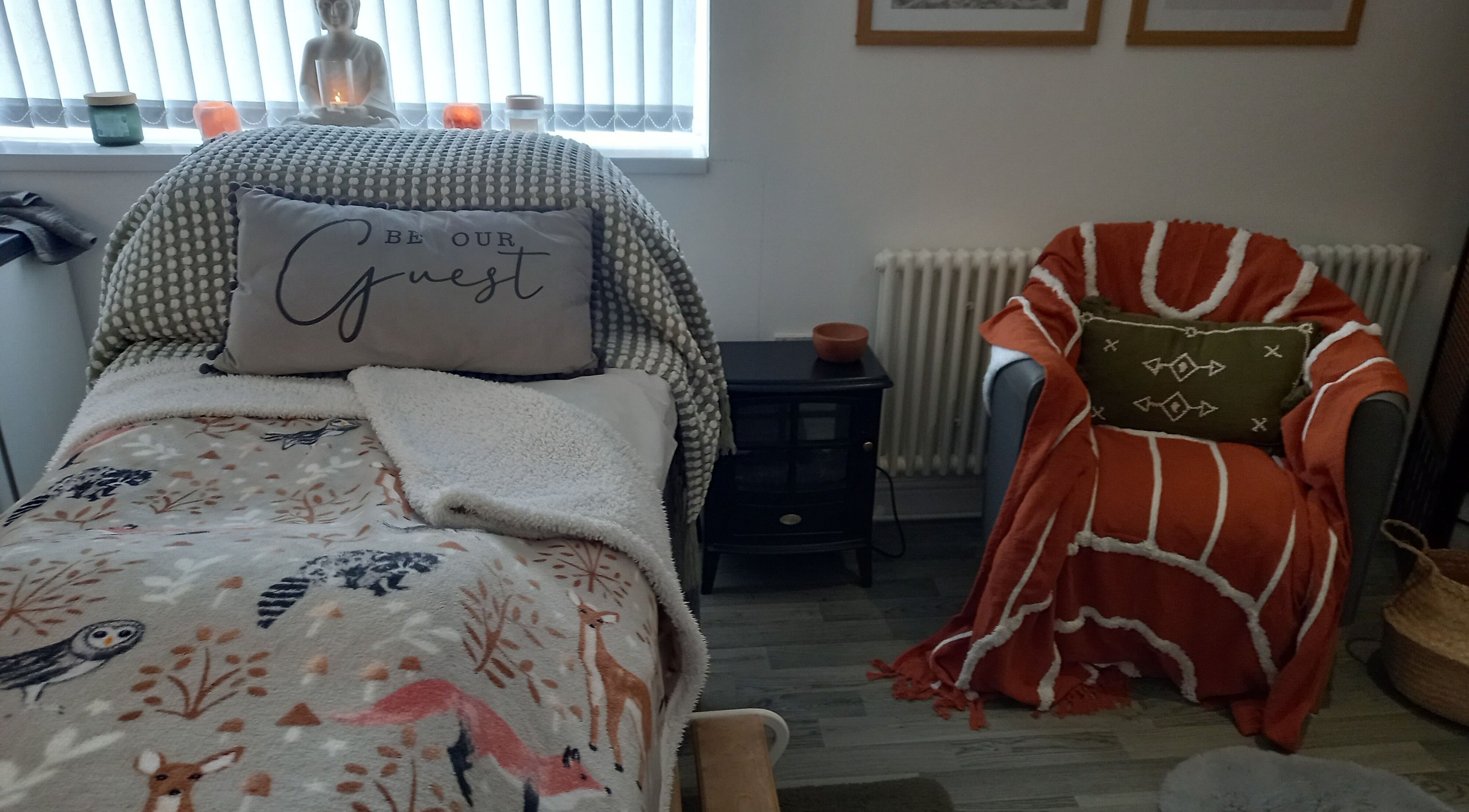 Relaxing treatment room at Skin2Sole, Wath Upon Dearne, England, GB, with comfy chair and decorative pillows.