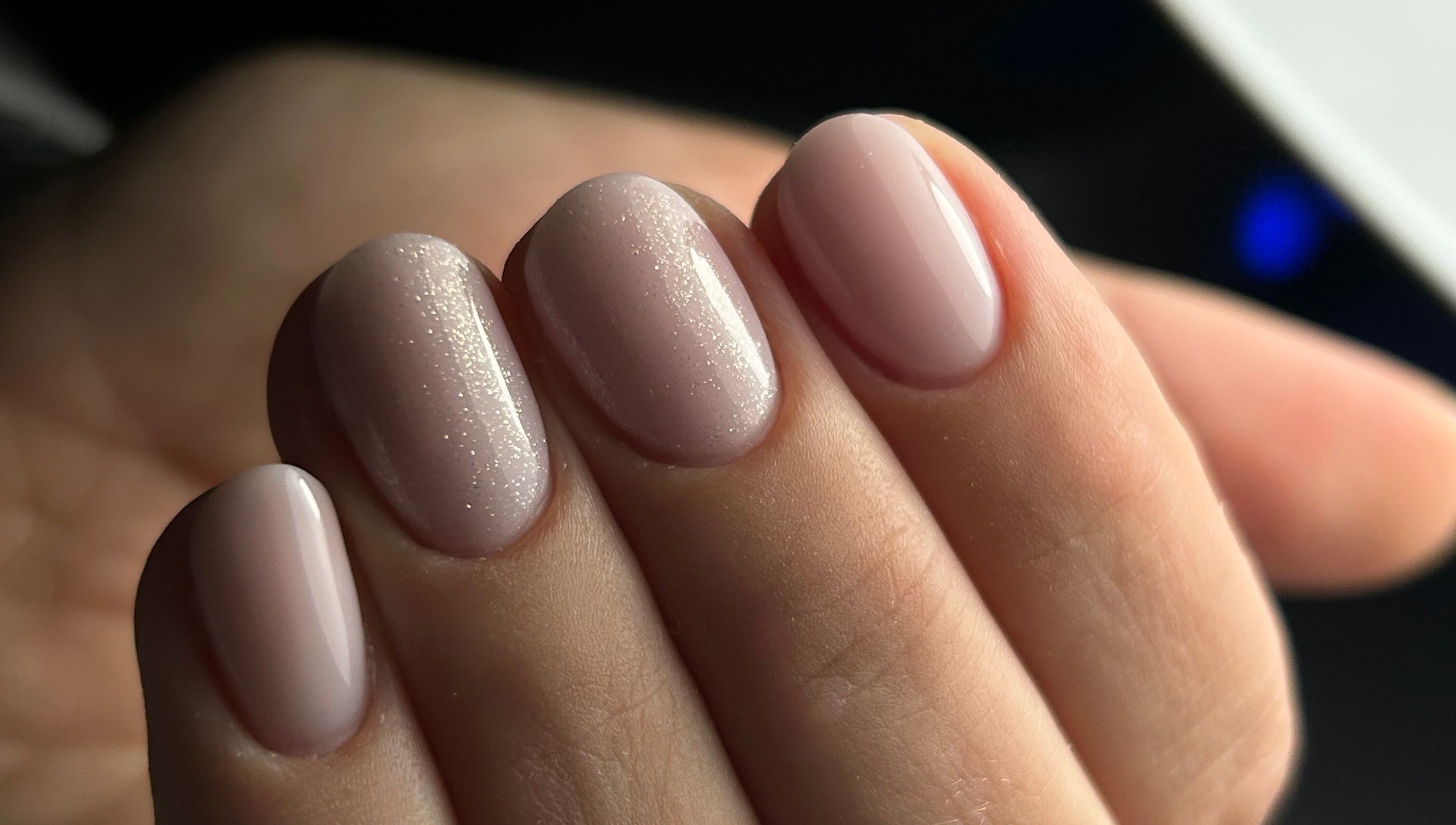 Sparkling nude manicure at Pink Nails by Alexandra, Basingstoke, England, GB.