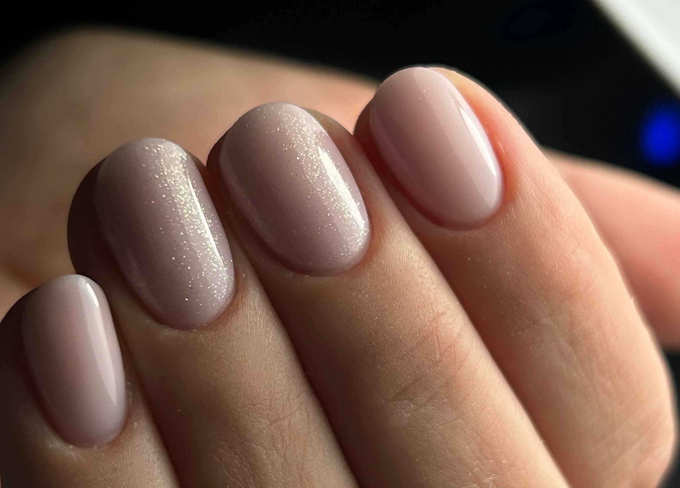 Sparkling nude manicure at Pink Nails by Alexandra, Basingstoke, England, GB.