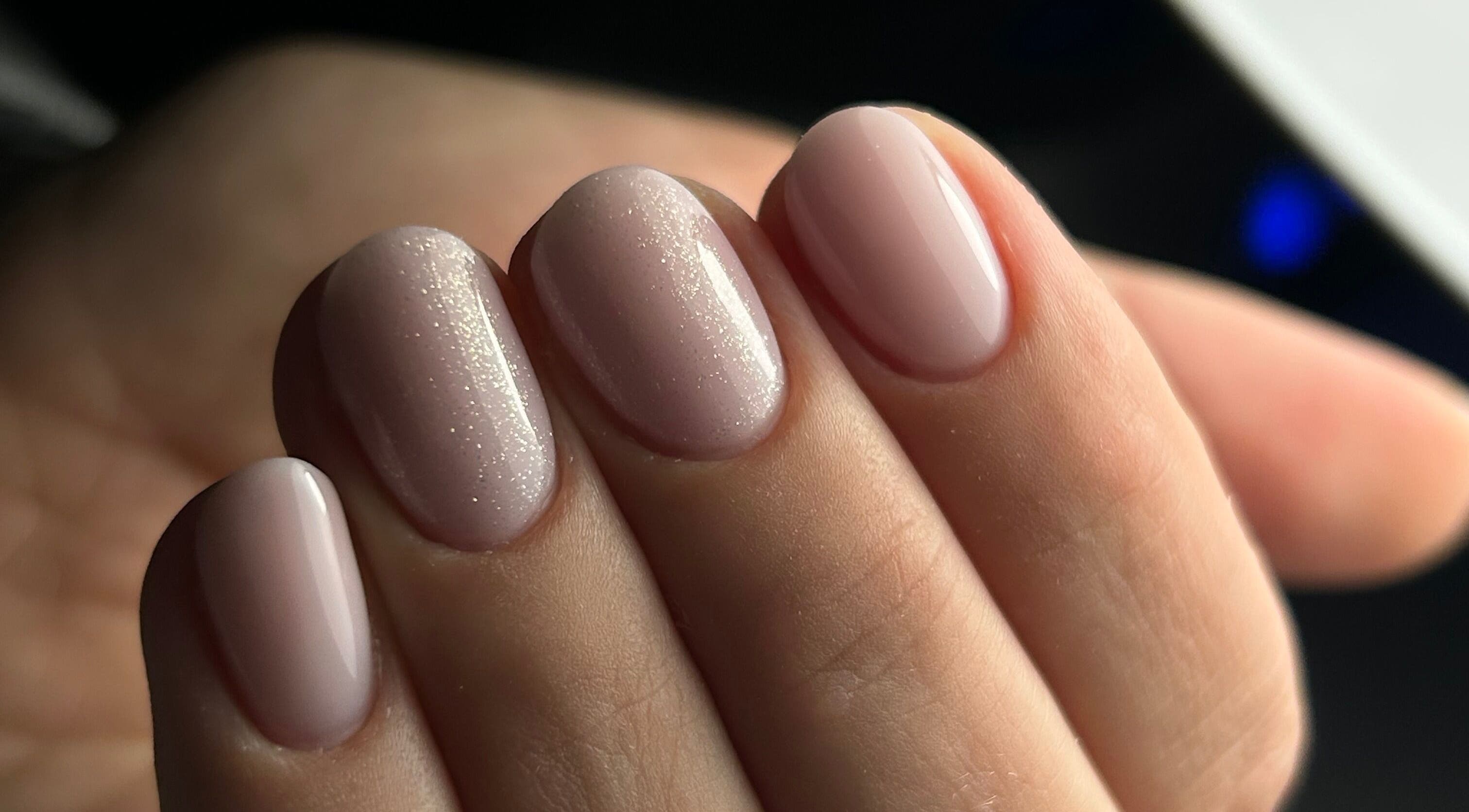 Sparkling nude manicure at Pink Nails by Alexandra, Basingstoke, England, GB.