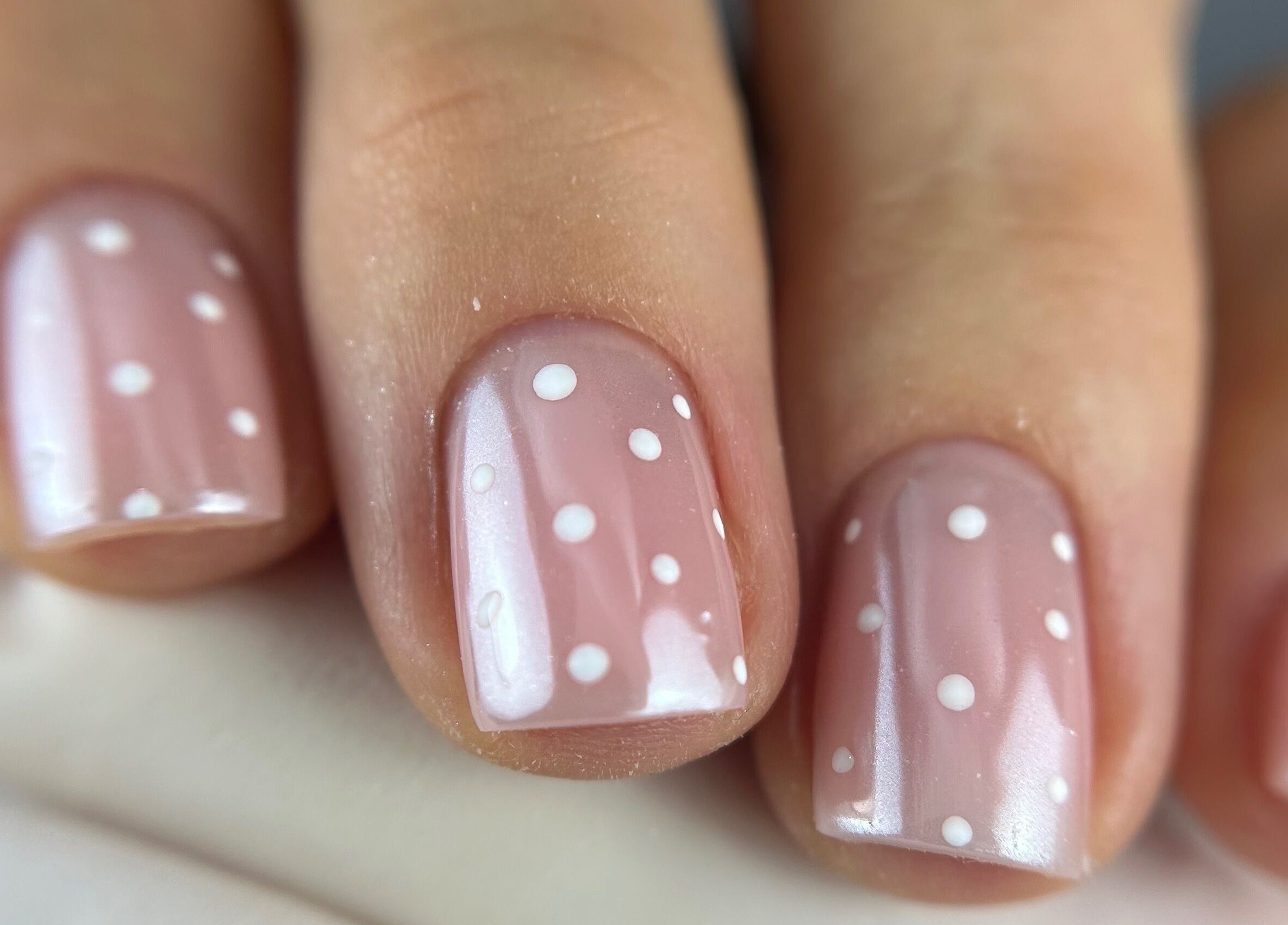 Close-up of polka dot nail art at Pink Nails by Alexandra, Basingstoke, England, GB.