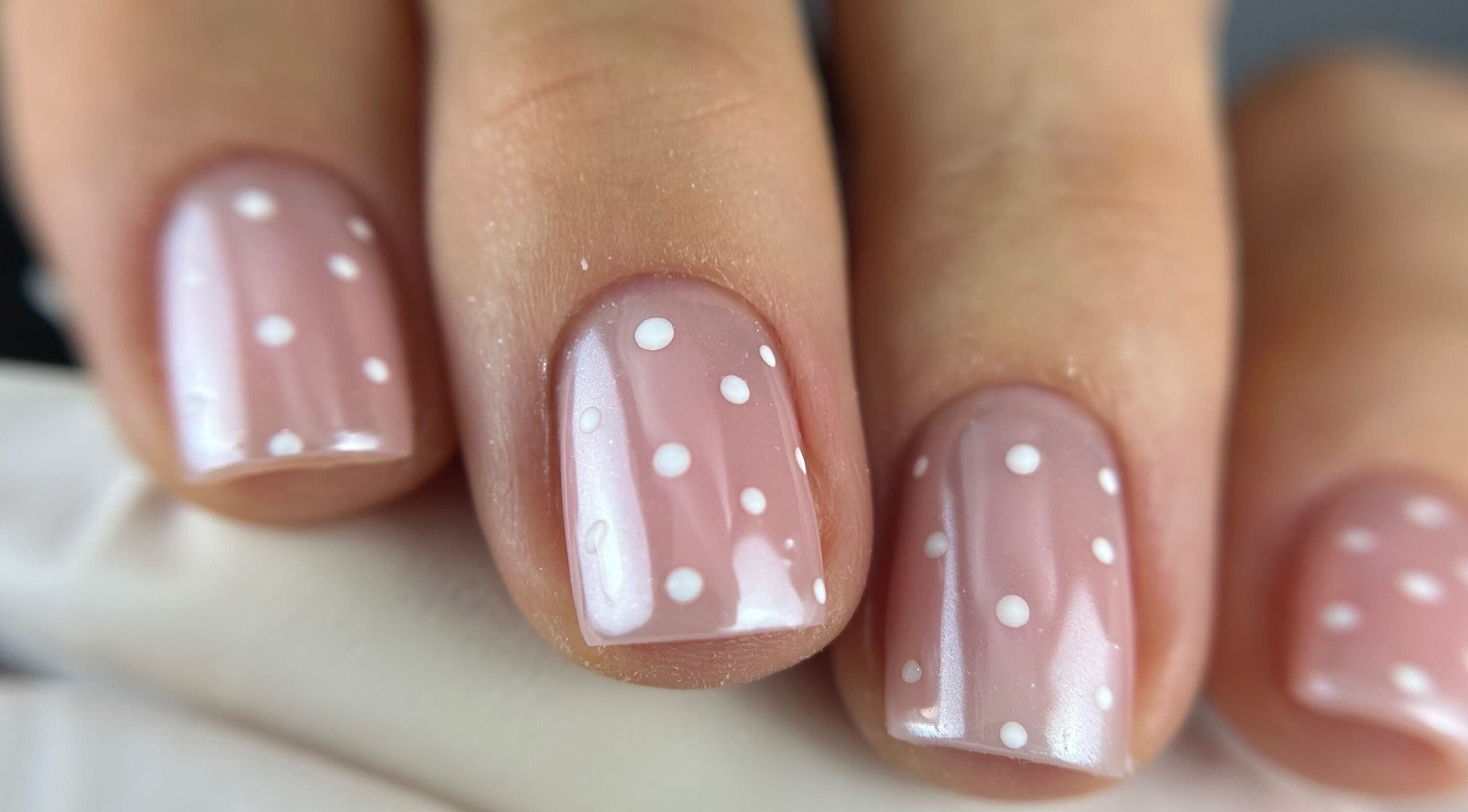 Close-up of polka dot nail art at Pink Nails by Alexandra, Basingstoke, England, GB.