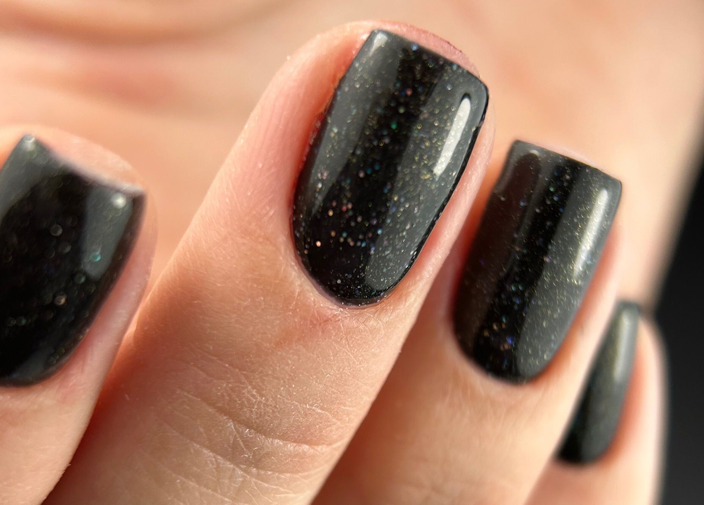 Close-up of glittery black nails at Pink Nails by Alexandra, Basingstoke, England, GB.