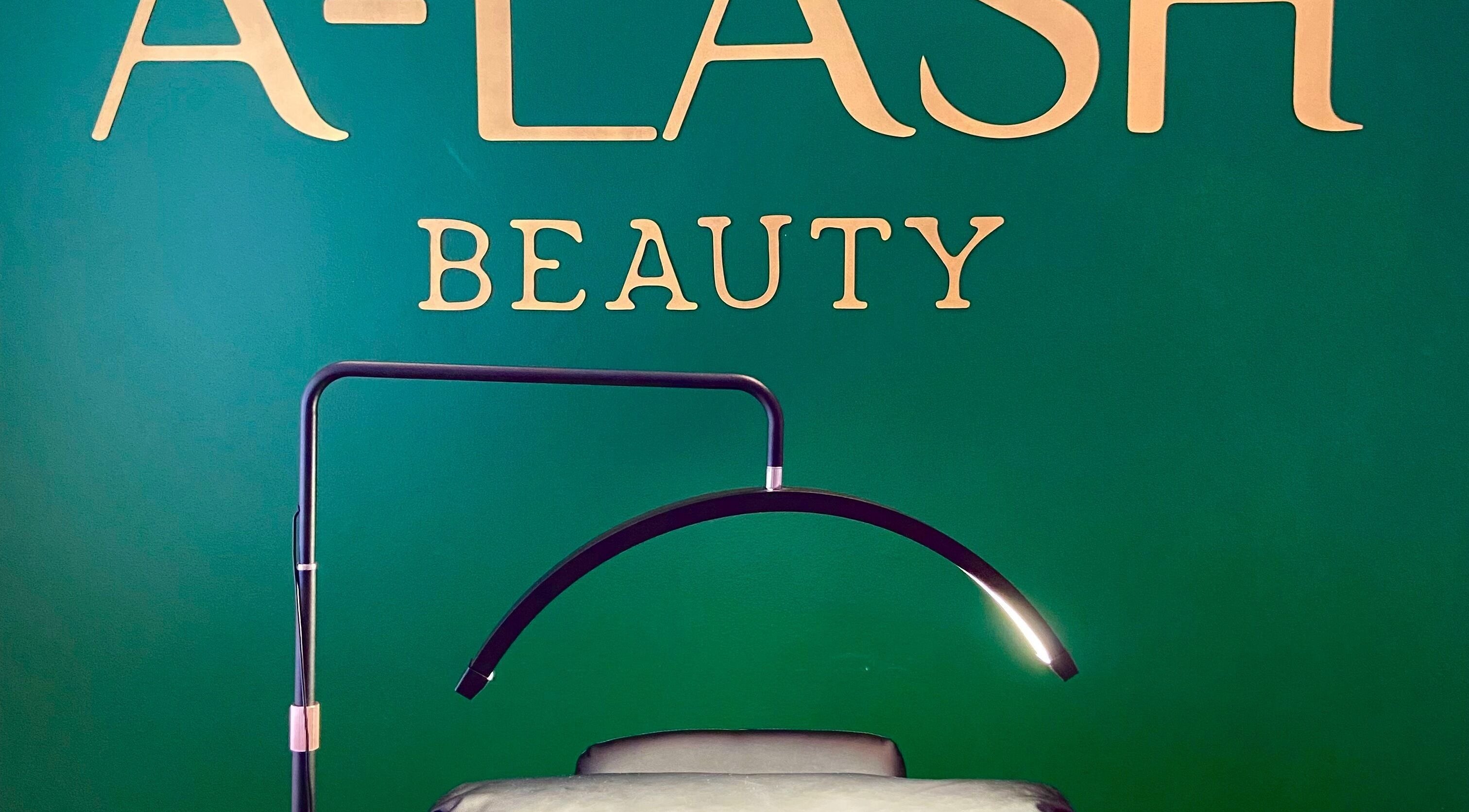 Cozy interior of A Lash Beauty with treatment bed and lamp, located in Cape Town, Western Cape, ZA.