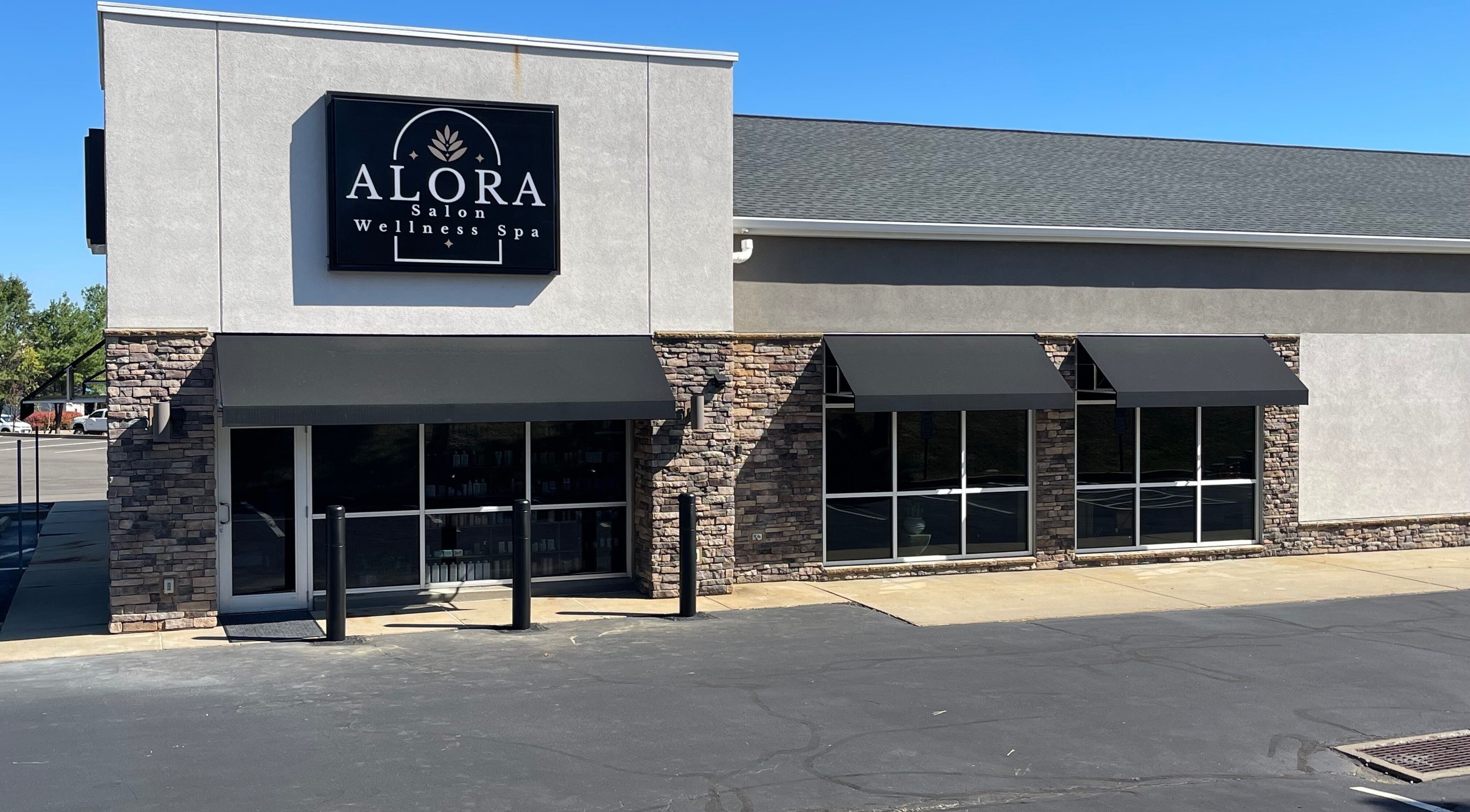 Alora Salon's sleek exterior in Pittsburgh, Pennsylvania, US, showcasing modern stonework and style.