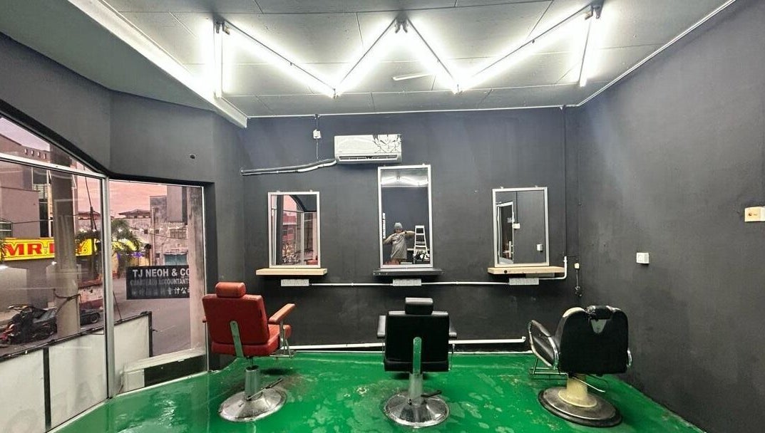 Stylish interior of JBAT Barbershop in Nibong Tebal, Pulau Pinang, MY with modern barber chairs and sleek design.