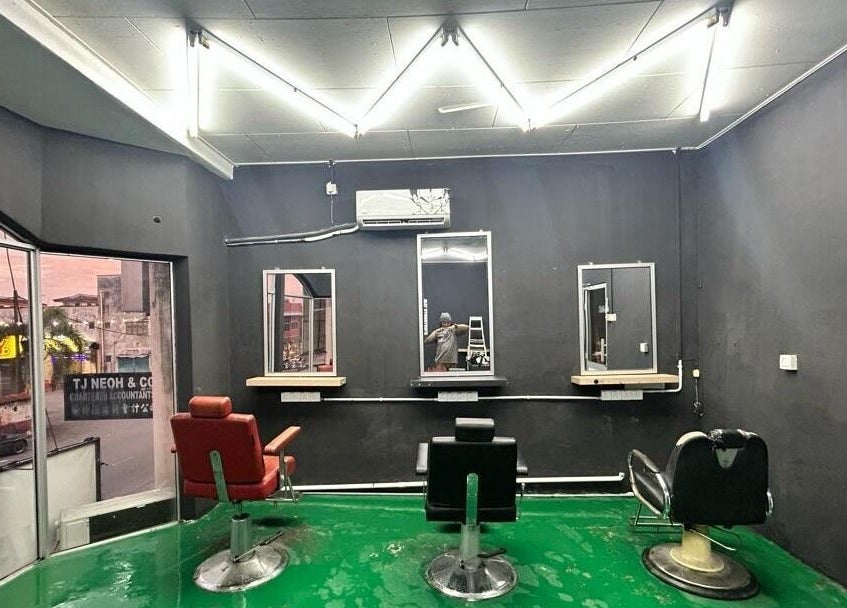 Stylish interior of JBAT Barbershop in Nibong Tebal, Pulau Pinang, MY with modern barber chairs and sleek design.
