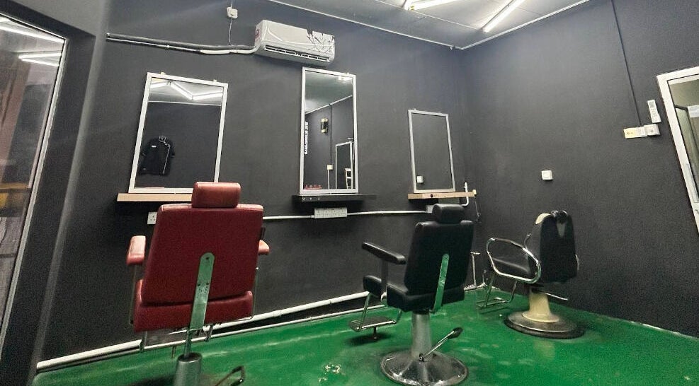 Interior of JBAT Barbershop in Nibong Tebal, Pulau Pinang, MY with modern barber chairs and mirrors.