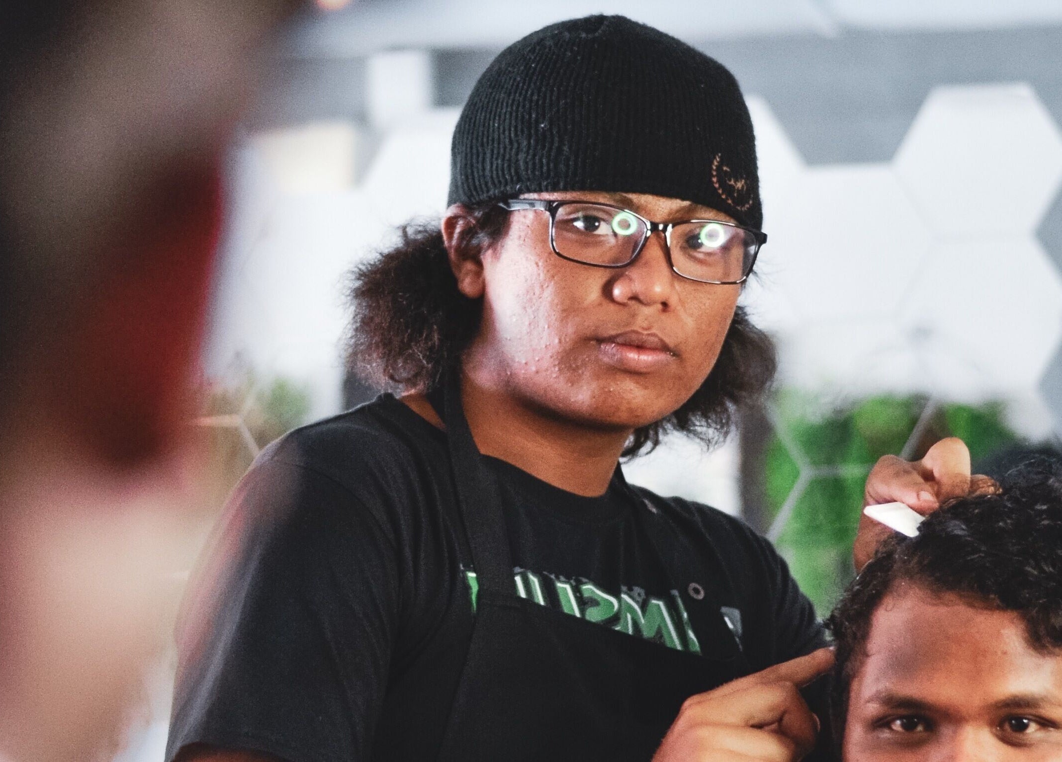 JBAT Barbershop stylist giving a haircut in Nibong Tebal, Pulau Pinang, MY.