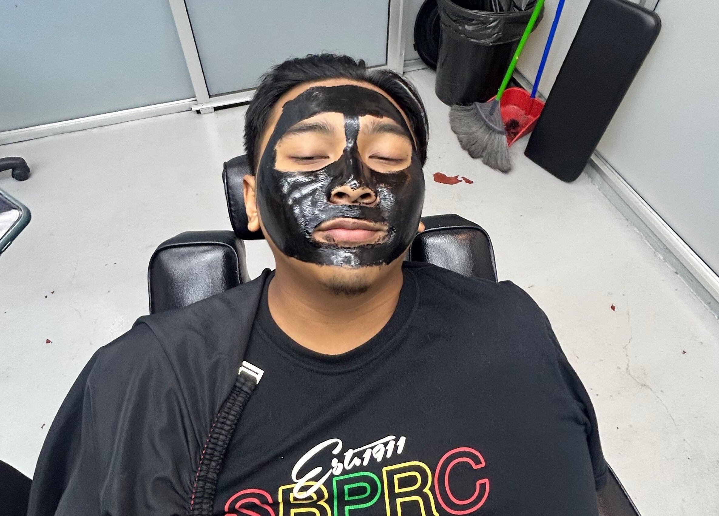 Client enjoying a facial mask at JBAT Barbershop, Nibong Tebal, Pulau Pinang, MY.