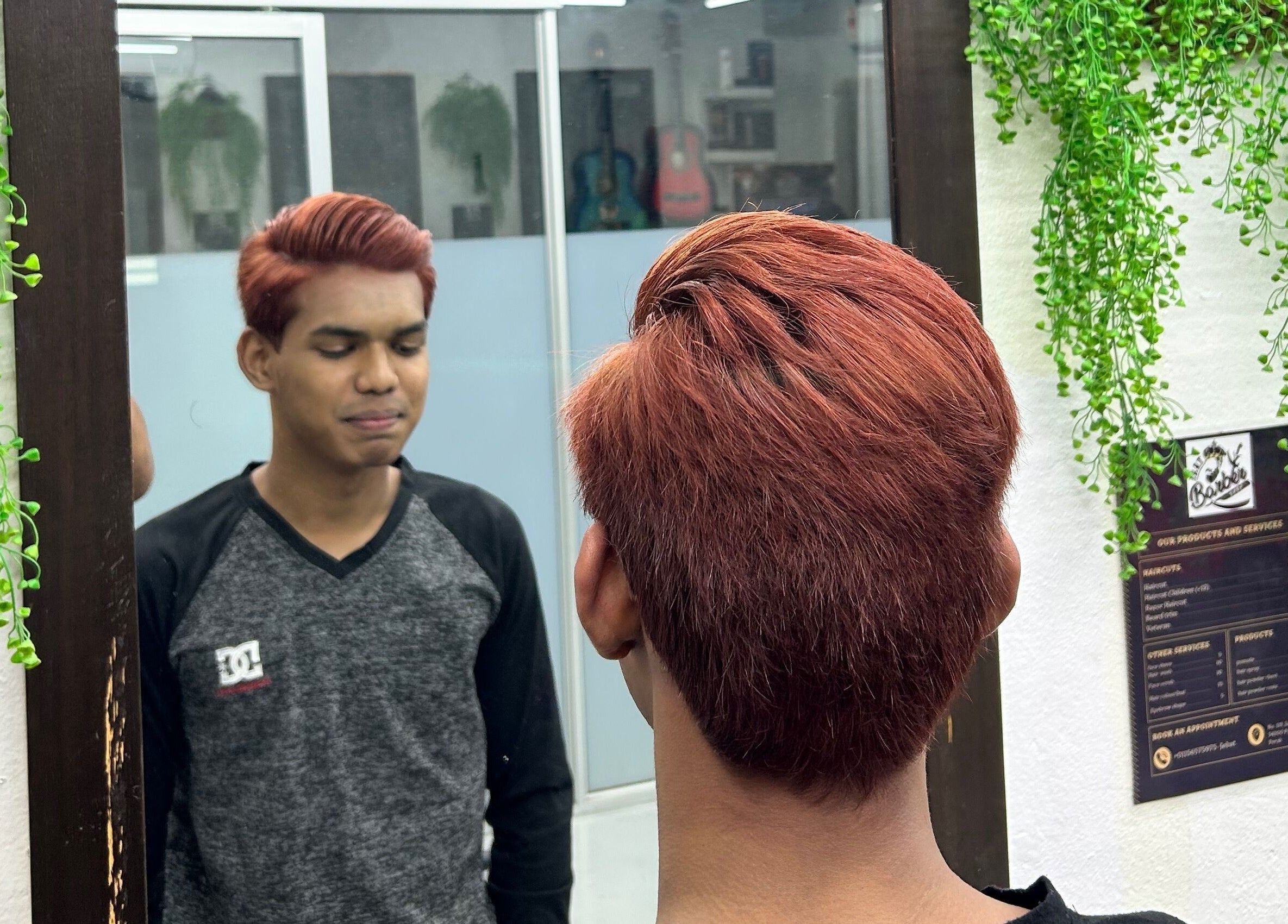 Client admires new haircut at JBAT Barbershop, Nibong Tebal, Pulau Pinang, MY.