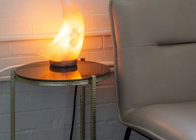 Cozy seating area with a glowing salt lamp at Good Moon Bodywork (Jaz Frazier, LMT), Buffalo, New York, US.