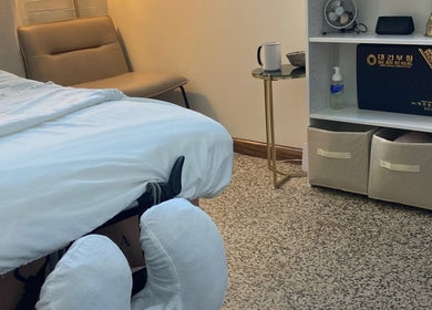 Relaxing massage room at Good Moon Bodywork (Jaz Frazier, LMT) in Buffalo, New York, US with soothing decor.