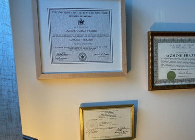 Certificates on display at Good Moon Bodywork (Jaz Frazier, LMT) in Buffalo, New York, US, showcasing qualifications.