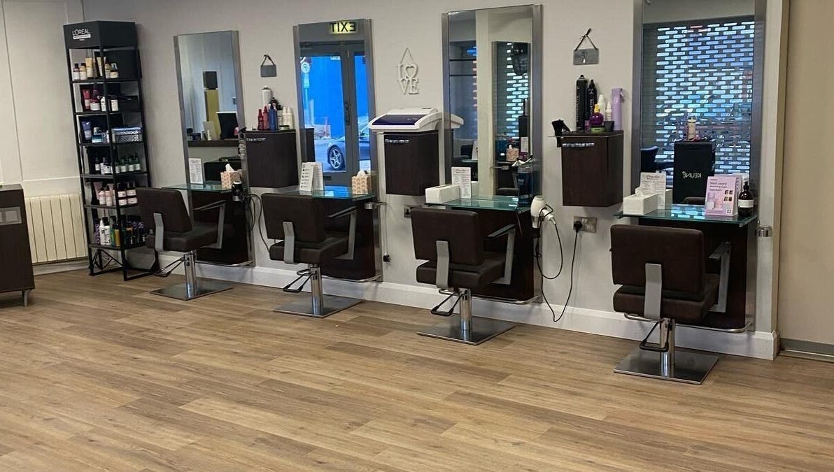 Modern hair stations at Hair by Shauna limited, Limerick, County Limerick, IE featuring sleek chairs and mirrors.