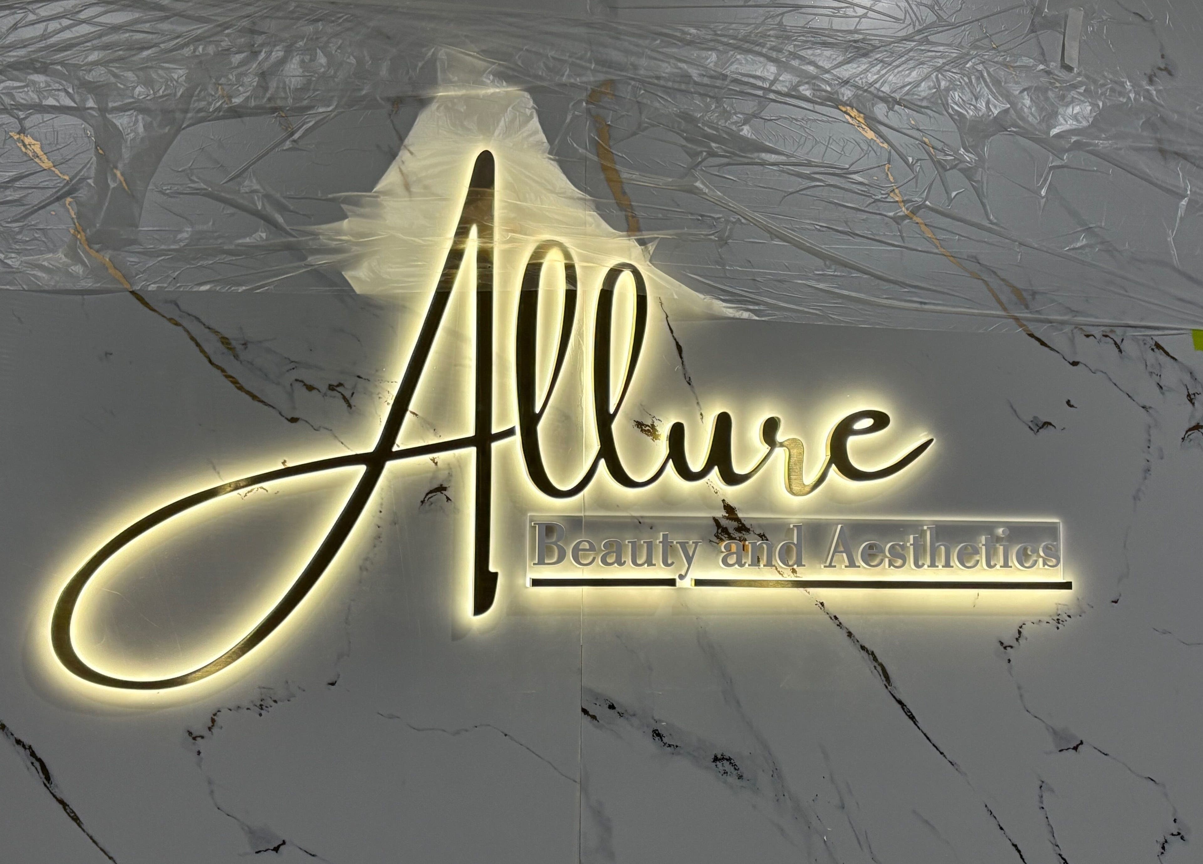 Illuminated Allure Beauty and Aesthetics logo on marble wall in Paralowie, South Australia, AU.