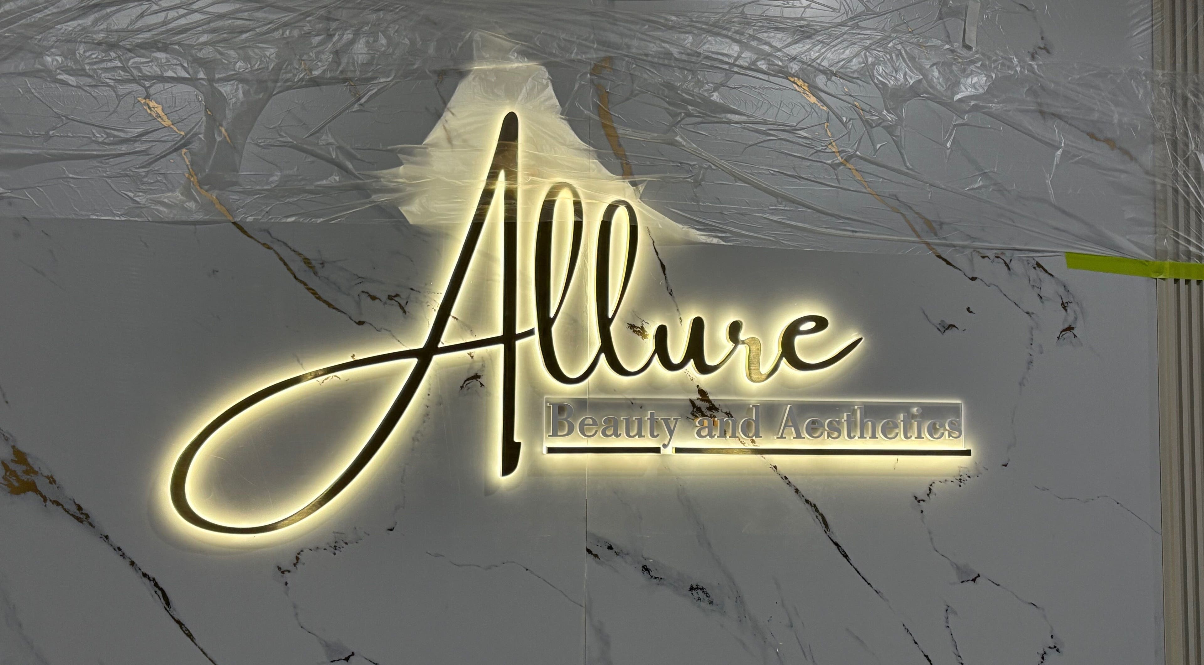 Illuminated Allure Beauty and Aesthetics logo on marble wall in Paralowie, South Australia, AU.