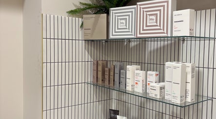 Skincare products displayed on glass shelf at Allure Beauty and Aesthetics, Murray Bridge, South Australia, AU.