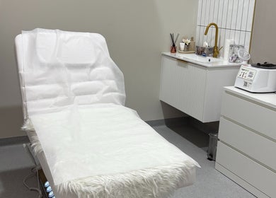 Serene treatment room at Allure Beauty and Aesthetics, Murray Bridge, South Australia, AU, featuring a massage table.