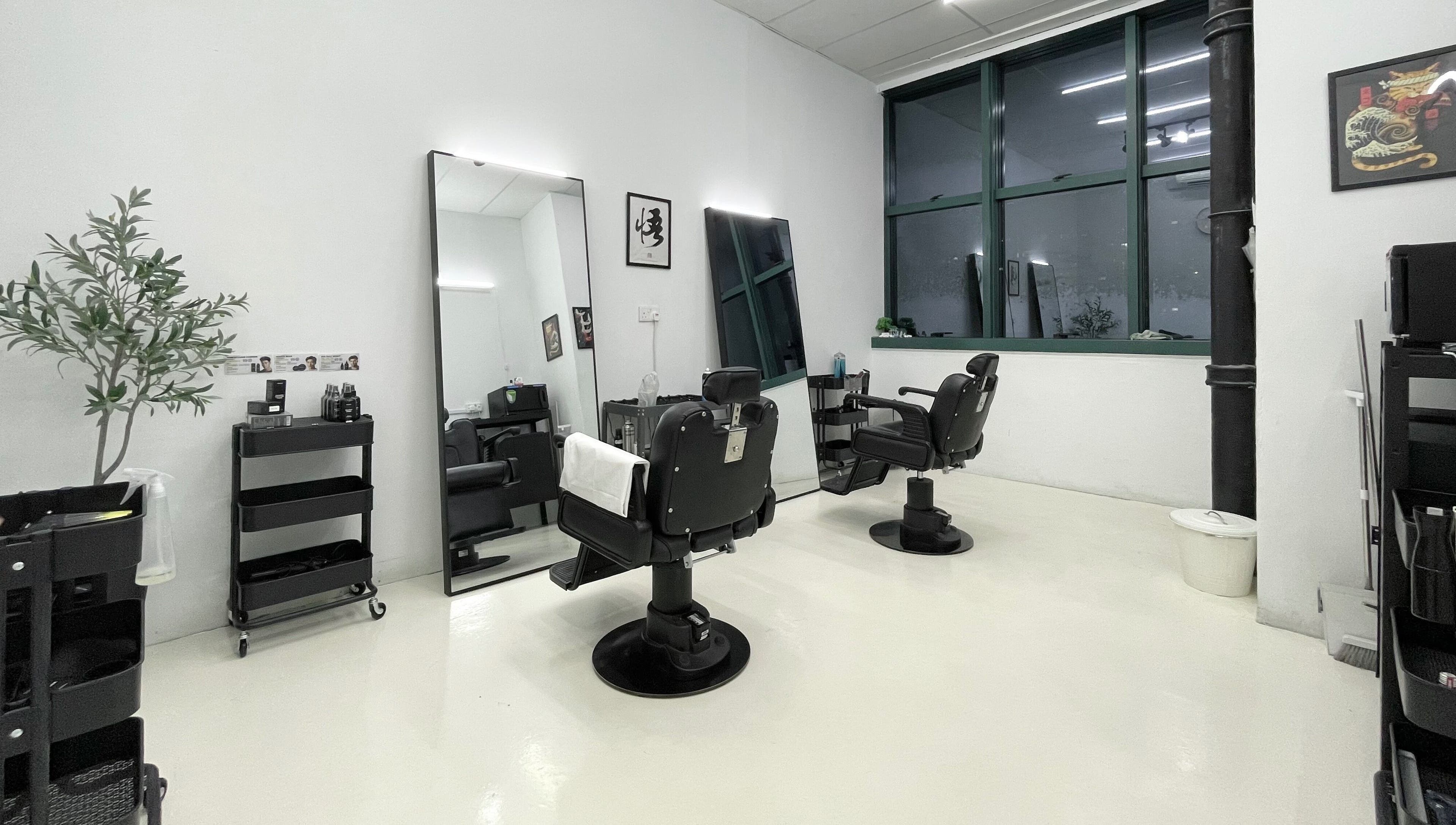 Modern salon interior at Kami Studio, Singapore, SG featuring stylish chairs and sleek mirrors.