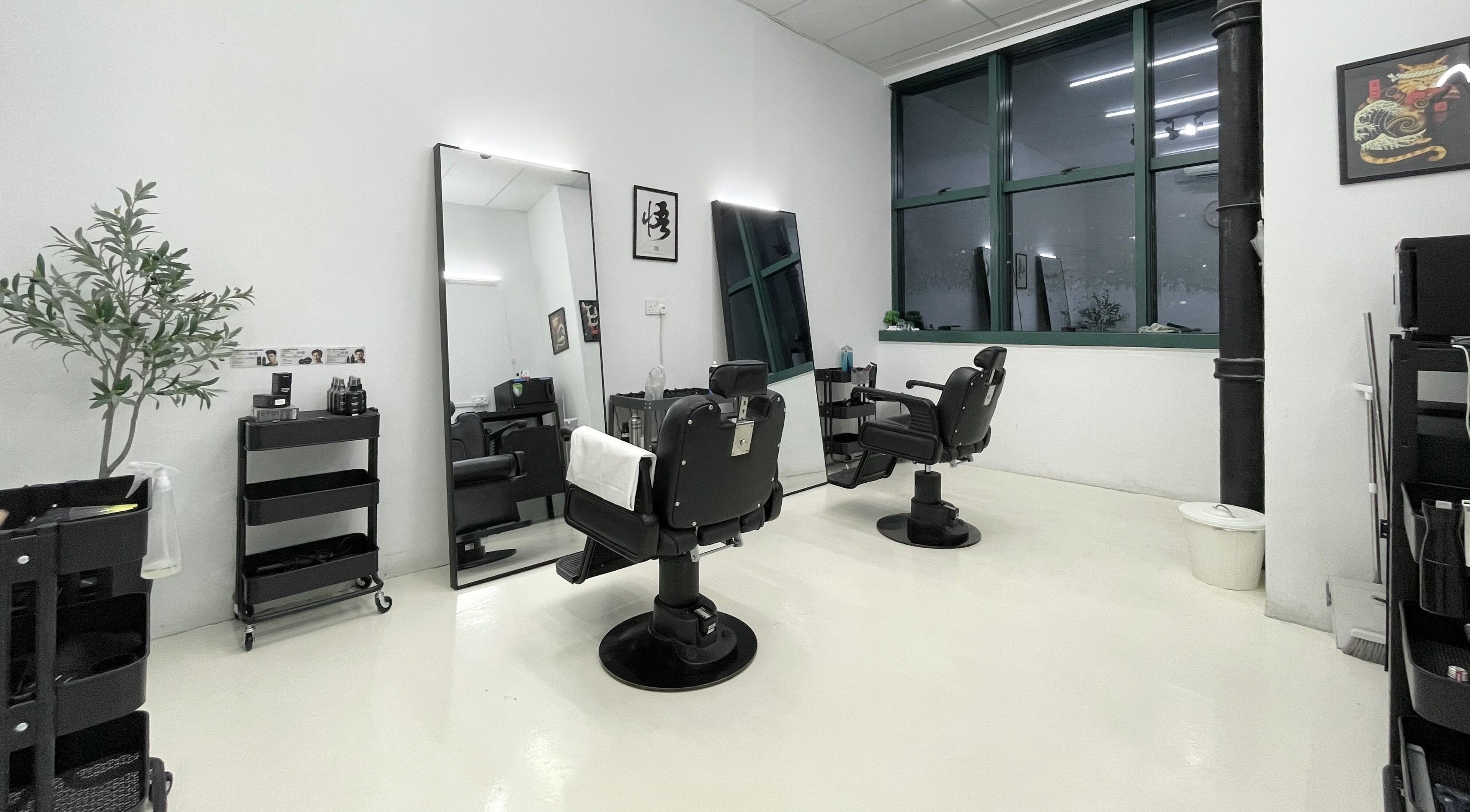 Modern salon interior at Kami Studio, Singapore, SG featuring stylish chairs and sleek mirrors.