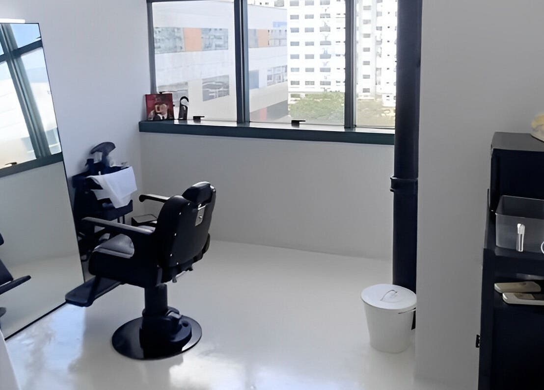 Modern barber chair and mirror setup at Kami Studio, Singapore, Singapore, SG, offering stylish grooming.