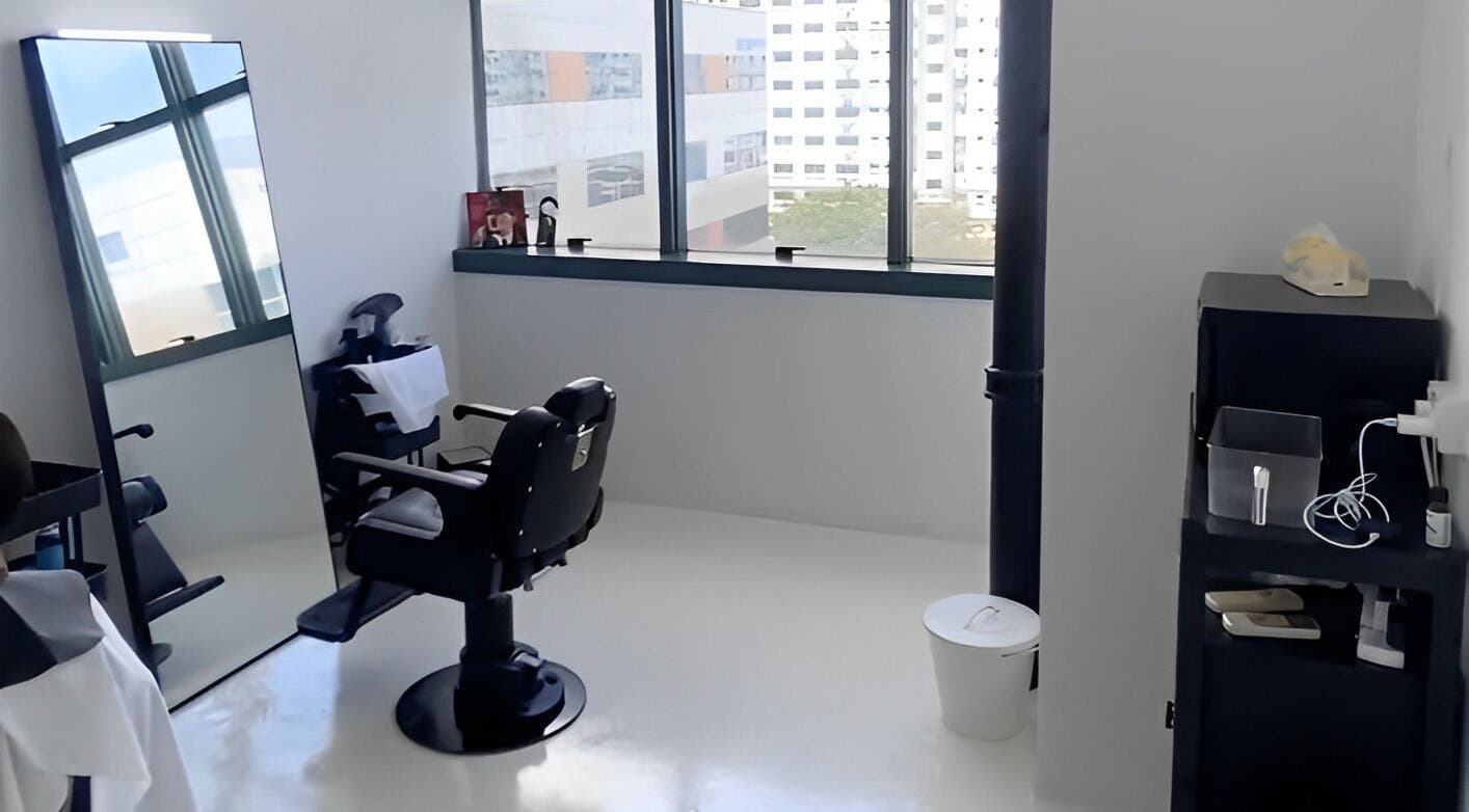 Modern barber chair and mirror setup at Kami Studio, Singapore, Singapore, SG, offering stylish grooming.