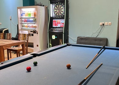 Pool table and dartboard in Kami Studio, a cozy venue in Singapore, Singapore, SG.