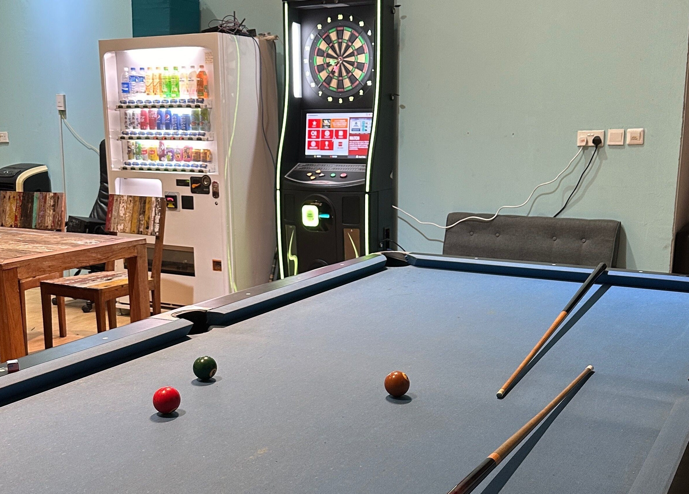 Pool table and dartboard in Kami Studio, a cozy venue in Singapore, Singapore, SG.