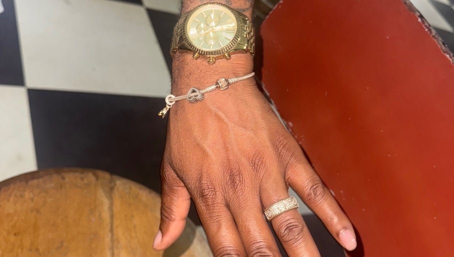 Stylish hand with ring and watch at Lavish Klawz and Nail Supplies Limited, Kingston, St. Andrew Parish, JM.