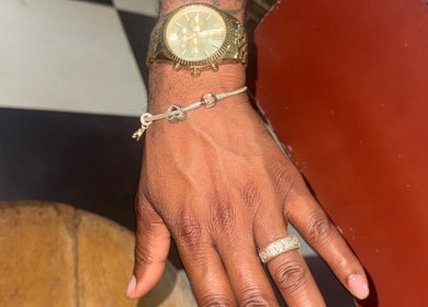 Stylish hand with ring and watch at Lavish Klawz and Nail Supplies Limited, Kingston, St. Andrew Parish, JM.