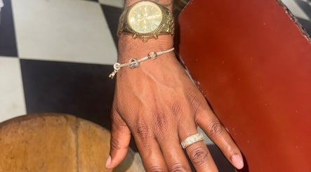 Stylish hand with ring and watch at Lavish Klawz and Nail Supplies Limited, Kingston, St. Andrew Parish, JM.