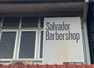 Salvador Barbershop signage at Changlun, Kedah, MY, highlighting the modern facade.