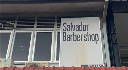 Salvador Barbershop signage at Changlun, Kedah, MY, highlighting the modern facade.