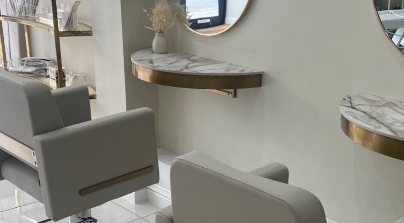 Stylish salon interior with marble decor at Hair By Heidi, Wigston, England, GB