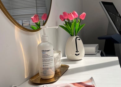 Elegant vanity at The Bloom Aesthetics in Hereford, England, GB with tulips and skincare essentials.