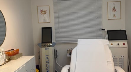 Treatment room at The Bloom Aesthetics in Hereford, England, GB with modern equipment and a relaxation chair.