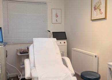Relaxing treatment room at The Bloom Aesthetics, Hereford, England, GB with modern chair and decor.