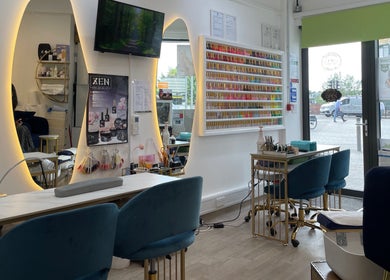 Interior of Sky Nails, a chic nail salon in Brentford, England, GB, showcasing vibrant polish displays and modern seating.