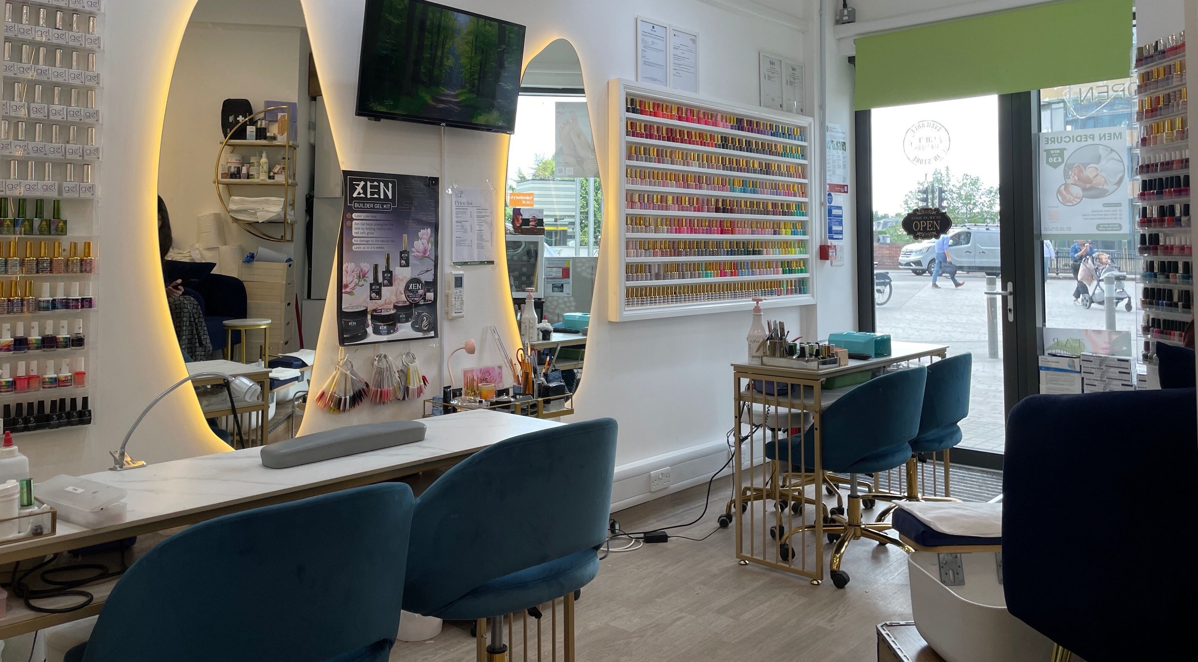 Interior of Sky Nails, a chic nail salon in Brentford, England, GB, showcasing vibrant polish displays and modern seating.