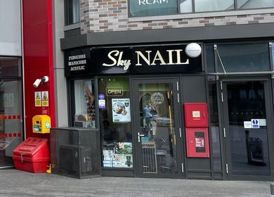 Entrance of Sky Nails, Brentford, England, GB, showcasing modern salon exterior.