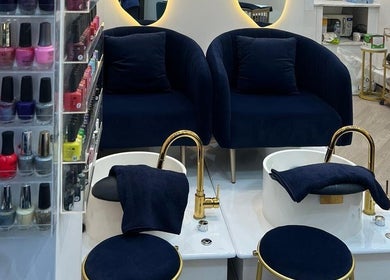 Luxurious pedicure setup at Sky Nails in Brentford, England, GB featuring plush seating and diverse nail polish display.