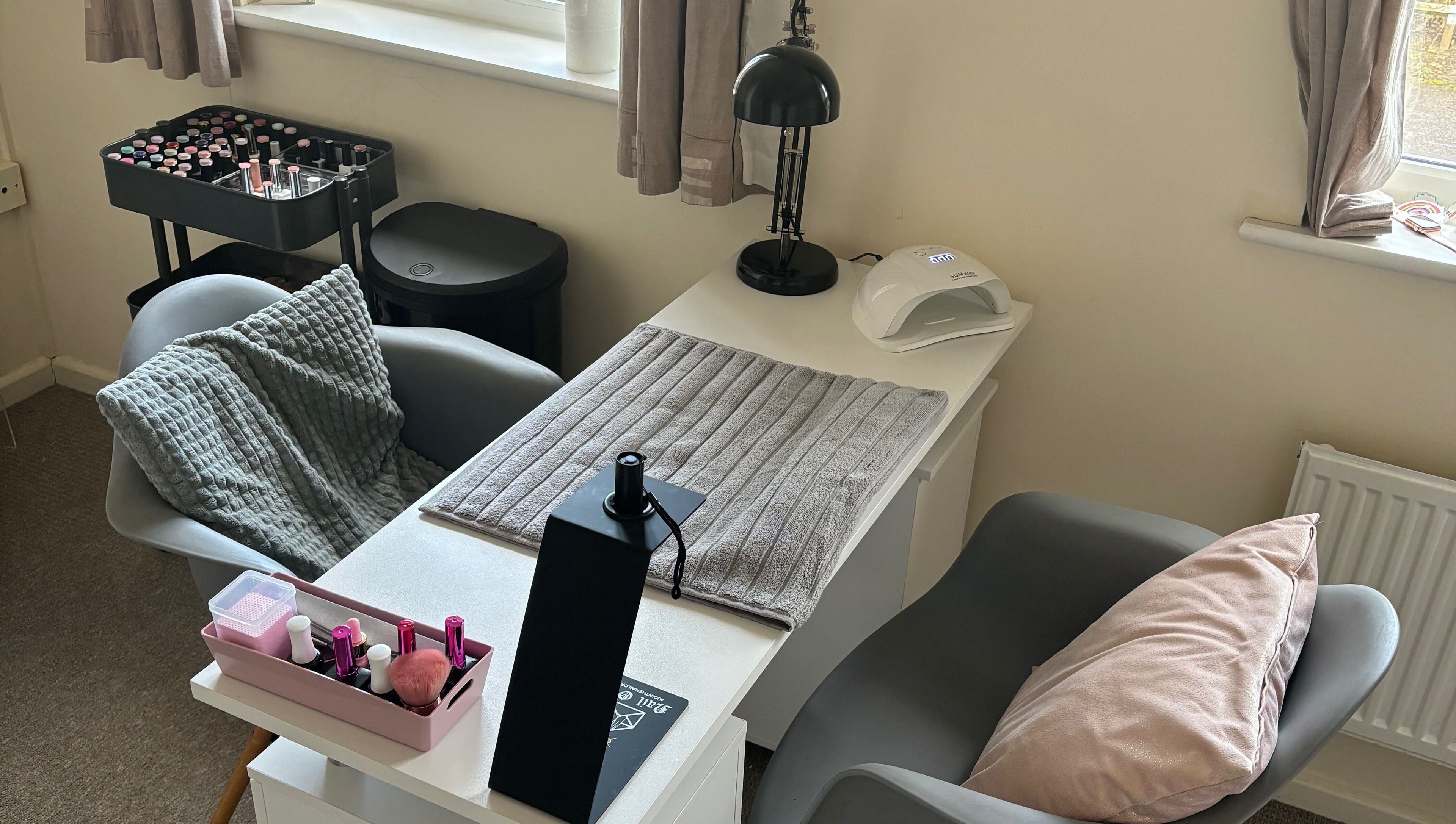 Cozy nail station at Nailsbyebonyy in Rainham, England, GB, offering a relaxing manicure experience.