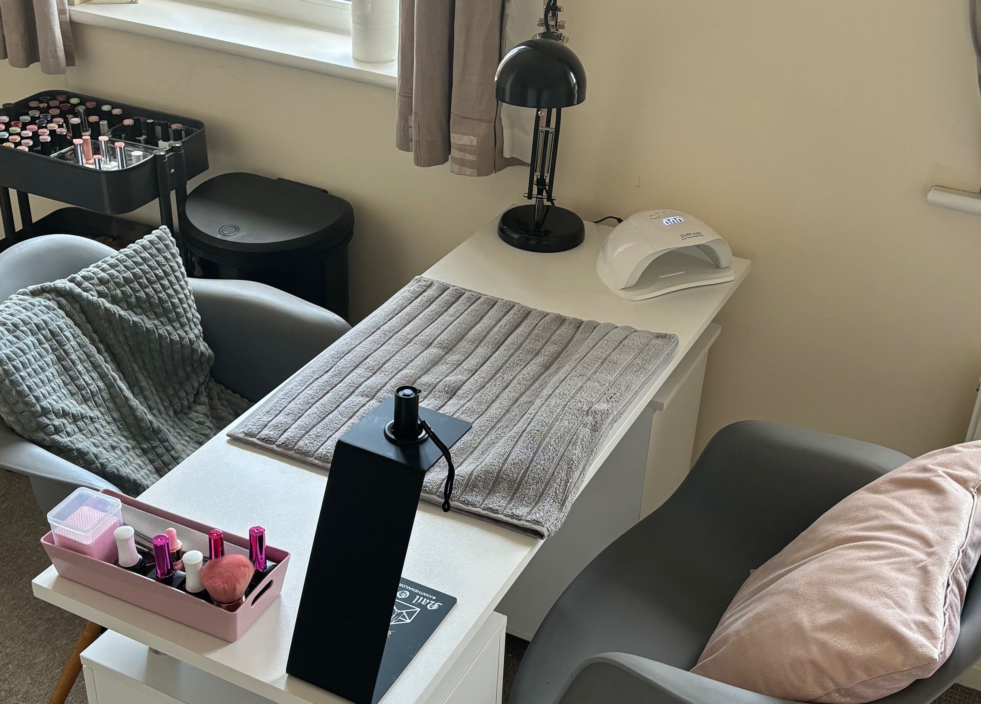 Cozy nail station at Nailsbyebonyy in Rainham, England, GB, offering a relaxing manicure experience.