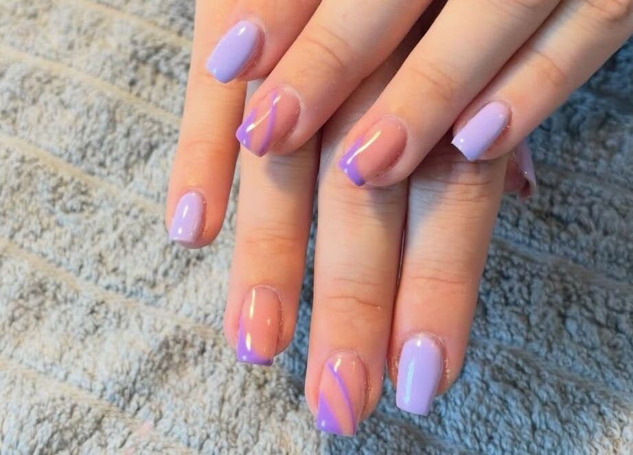 Elegant lavender nail art by Nailsbyebonyy in Rainham, England, GB displayed on a plush towel.