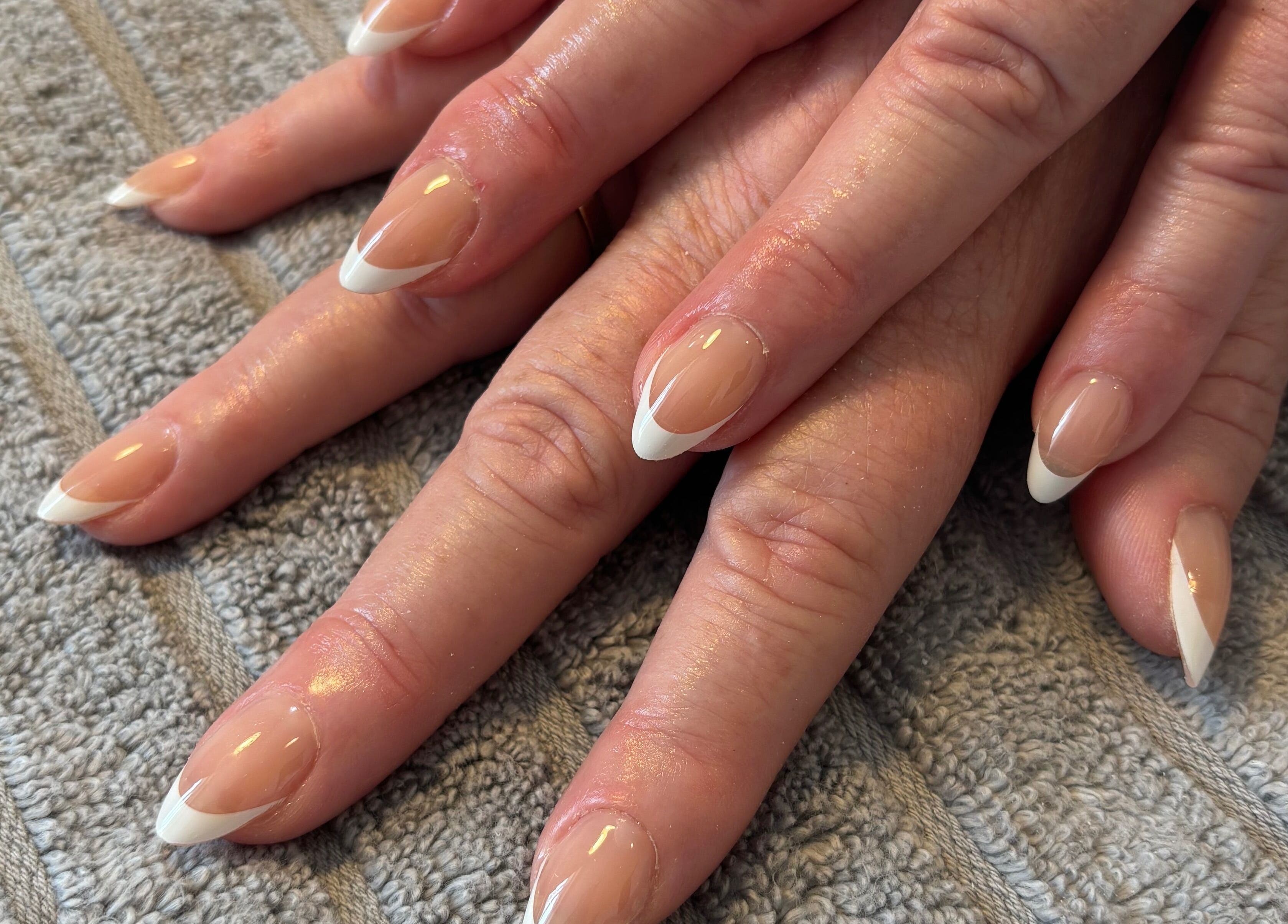 Elegant French manicure at Nailsbyebonyy, Rainham, England, GB, showcasing expertly crafted nail art.